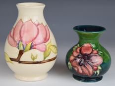 Two pedestal Moorcroft vases decorated in the Magnolia and Anemone patterns, tallest 14cm