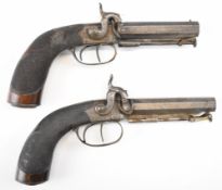 A pair of unnamed double barrelled side by percussion hammer action pistols, each with scrolling
