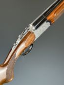 Sabatti 12 bore over under ejector shotgun with engraved locks, underside, trigger guard, top