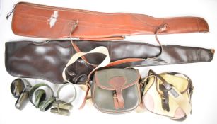 A collection of gun or shooting accessories comprising two faux leather gun slips, two shotgun