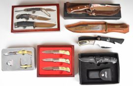 Seven Winchester and Walther knives and knife sets including one with laminated show wood handle,
