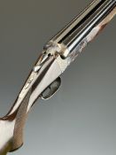 AYA 10 bore side by side ejector shotgun with engraved thumb lever, chequered semi-pistol grip and