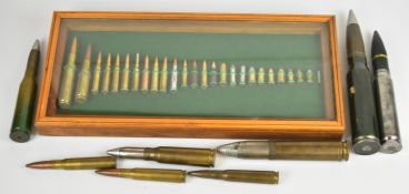 Collector of thirty four inert ammunition rounds of various calibres, including a glazed mounted