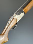 Lanber 12 bore over and under shotgun with engraved birds surrounded by scrolling decoration to