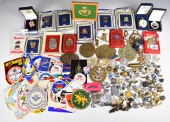 A collection of various badges, medals and buttons including Airborne, Royal Air Force, Spitfire,