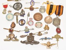 Approximately twenty five badges including Royal Army Temperance Association, silver War Badge