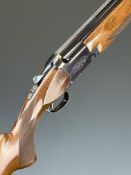 Miroku 12 bore over and under ejector shotgun with engraved locks and underside, chequered semi-