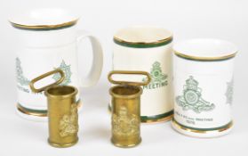 Two brass flag pole holders and three Royal Artillery shooting mugs for 1973, 1974 and 1976