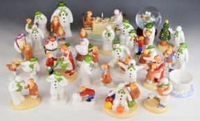 Twenty nine Coalport Raymond Briggs 'The Snowman' figures including Walking In The Air snow globe,