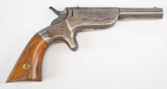 Unnamed .32 rimfire Derringer pistol with wooden grips, sheath trigger, fixed sights and 4 inch