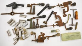 A collection of shotgun or rifle cartridge re-loading tools and gun accessories including roll