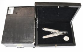 Leatherman Charge multi-tool with silver grip, limited edition 430/999 made for their 25th