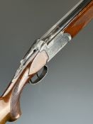 Felix Sarasketa 12 bore over and under shotgun with engraved locks, underside and thumb lever,