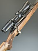 Tikka T3 .243 Winchester bolt-action rifle with chequered semi-pistol grip and forend, sling mounts,