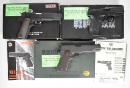 Three gas blowback semi-automatic airsoft pistols comprising Marui Colt M1911 A1, WE M1911 and WE