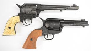 Two replica revolvers Colt Single Action Army .45 with faux ivory grips and 7 inch barrel and