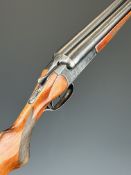 Baikal IJ-58 MAE 12 bore side by side ejector shotgun with heavy engraving of birds and rabbits to