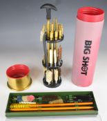 Two shotgun or rifle cleaning kits comprising Big Shot with case in the form of a shot gun cartridge