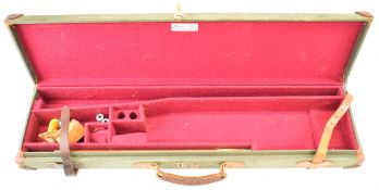 Two shotgun carry cases, one a Brady leather and canvas bound example with 'Brady Sporting Leather
