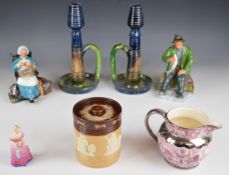 Ceramics including a pair of Arts & Crafts pottery chambersticks, two Royal Doulton character