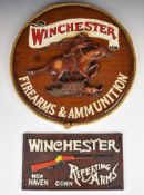 Two Winchester shop display or advertising signs, one Winchester Repeating Arms cast iron and one