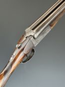 Ugaretechea 12 bore side by side shotgun with engraved locks, underside and fences, chequered grip