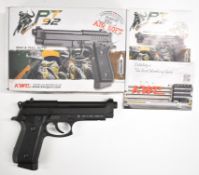 KWC PT92 6mm CO2 airsoft pistol with chequered composite grip and fixed sights, serial number