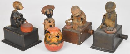 Four Japanese Kobe mechanical carved wood toys / dolls, tallest 10cm