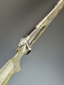 Ruger Scout .308 Winchester bolt-action rifle with laminated show wood stock, chequered semi-