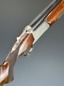 Nikko Model 5000 II 12 bore over and under ejector shotgun with engraved locks, trigger guard,