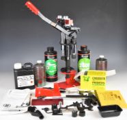 A collection of shotgun or rifle cartridge re-loading equipment and powders including MEC 600 Jr