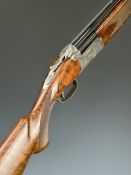 Winchester Select Platinum 12 bore over and under ejector shotgun with engraved scenes of birds to