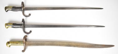 Two French 1874 pattern Gras bayonets, one with 1895 manufacture date, together with an 1842 pattern