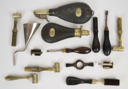 A collection of gun tools and accessories including four horn handled powder measures and four