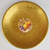 Royal Worcester painted fruit cabinet plate with heavily gilded surround, signed Stanley, diameter