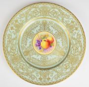 Royal Worcester painted fruit cabinet plate with gilded decoration on a pale blue ground, signed
