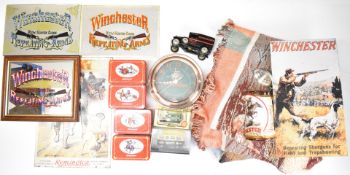 A collection of Winchester signs and ephemera comprising three mirrors, two metal signs, four