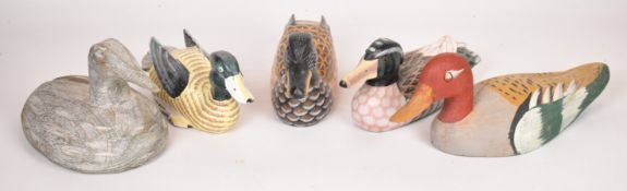 Five hand painted wooden decoy or similar ducks, largest 29.5cm long.