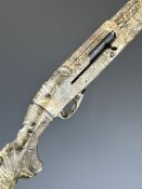 Revo Matrix 12 bore semi-automatic shotgun with Mossyoak Duck Blind finish, chequered semi-pistol