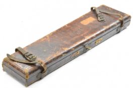 Two leather shotgun cases, one a leather and brass bound oak example with fitted interior and '