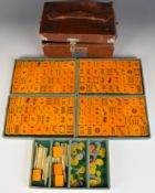 Chinese Mah-jong set, in leather case with plaque 'Van Fong National Products Co, Singapore', the