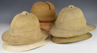 Six Wolseley / pith helmets, one with Hawkes & Co Ltd stamped to inner skull, another with a