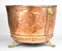 Riveted copper copper with lion mask ring handles, brass pad feet and twin handled liner, diameter