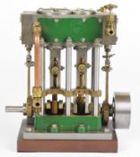 Stuart compound launch live steam engine with displacement lubricator, driving a solid flywheel,