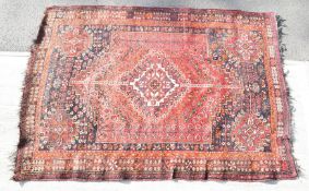 Large Persian rug with central gul and orange, blue and red borders, 250 x 177cm