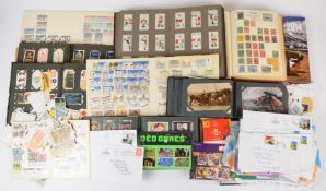 Stamps and cigarette cards collection in various albums and loose including a few Queen Elizabeth II