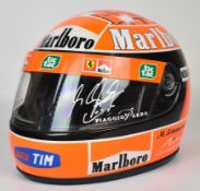 Michael Schumacher signed replica Formula 1 Ferrari helmet with Marlboro sponsorship, autographed in
