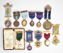 Eleven Freemasons and similar medals and jewels with five hallmarked examples including Harmony,