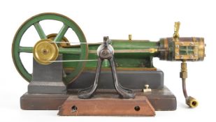 Victorian or early 20th century single cylinder live steam engine with spoked flywheel, with belt