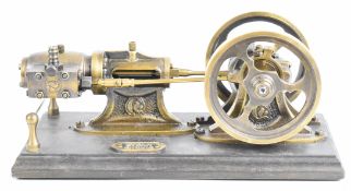 Polish made single cylinder live steam engine with twin spoked flywheels, on wooden base with